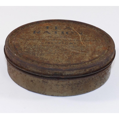 138 - A WWII tea ration 5oz circular tin, 'Containing tea, sugar and soluble milk powder', with contents, ... 