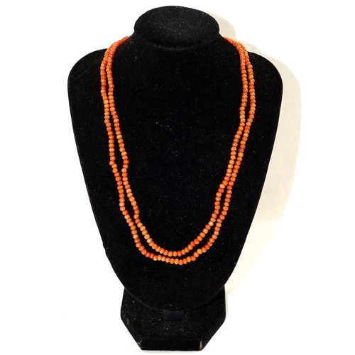 175 - A Victorian double row coral necklace, the small oval beads each approximately 2.5mm diameter, termi... 