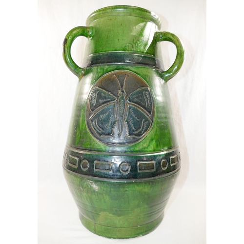 352 - A large Studio Pottery green glazed three handled vase, decorated with incised circular panels of bu... 