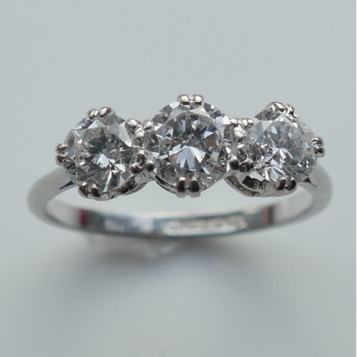 196A - A three stone diamond ring, the round brilliant cut stones approximately 0.45ct, 0.55ct and 0.45ct, ... 