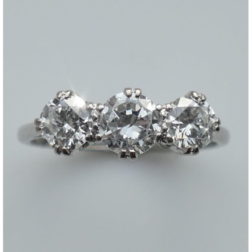 196A - A three stone diamond ring, the round brilliant cut stones approximately 0.45ct, 0.55ct and 0.45ct, ... 