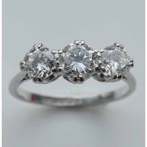 196A - A three stone diamond ring, the round brilliant cut stones approximately 0.45ct, 0.55ct and 0.45ct, ... 