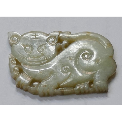 371A - A Chinese carved stone panel in the form of a cat, 6cm long, on hardwood stand, and a pierced and ca... 