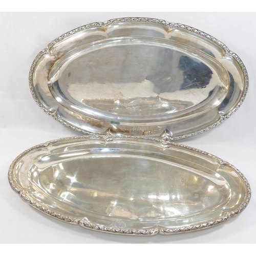 31 - A pair of French silver serving dishes, cast with ornate rim, bearing import marks for London 1939, ... 