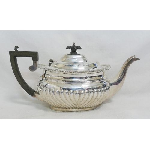 106 - An Edwardian silver teapot, Chester 1904, with half gadrooned body and ebonized handle and knop, 14c... 