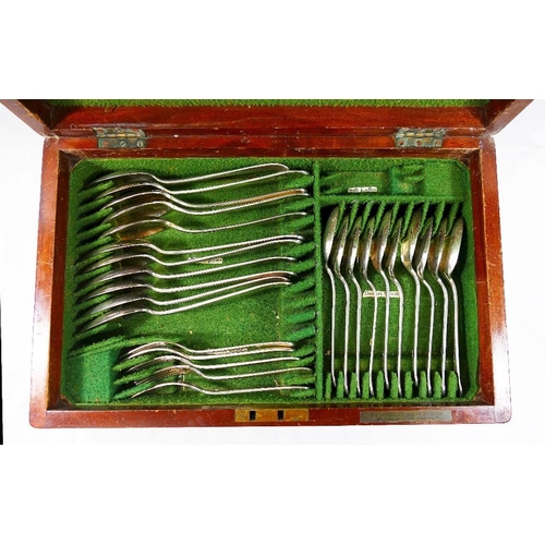 120 - An assortment of rats tail pattern silver plated cutlery, various makers, housed in a mahogany cante... 