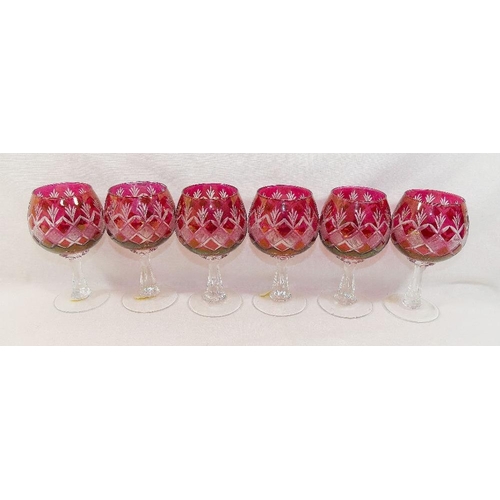 127 - Six cut glass ruby flashed wine glasses, a part suite of ruby flashed drinking glasses and other rub... 