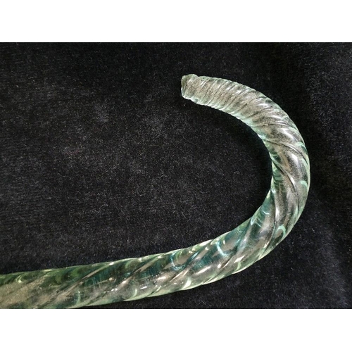 130 - A Victorian twisted green glass walking cane, 105cm long