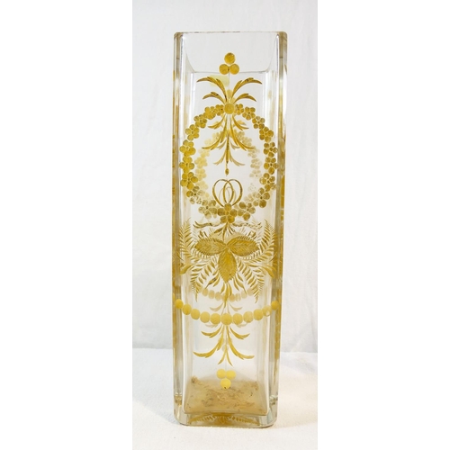 136 - A clear  square section tall glass vase with wheel engraved fruit and foliate decoration highlighted... 