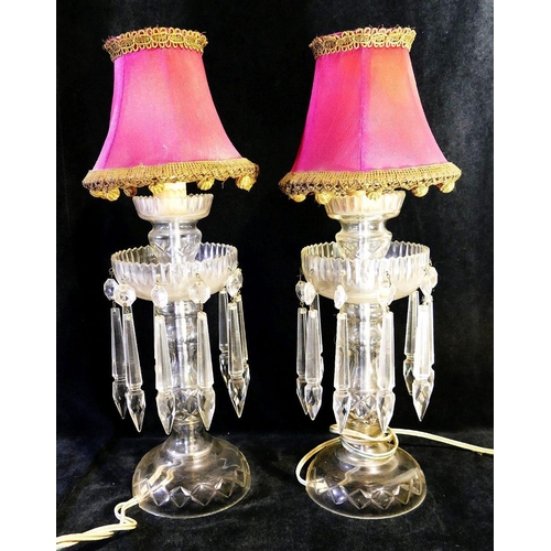 138 - A pair of Victorian clear cut glass vases hung with lustres, 23cm high and another pair converted to... 