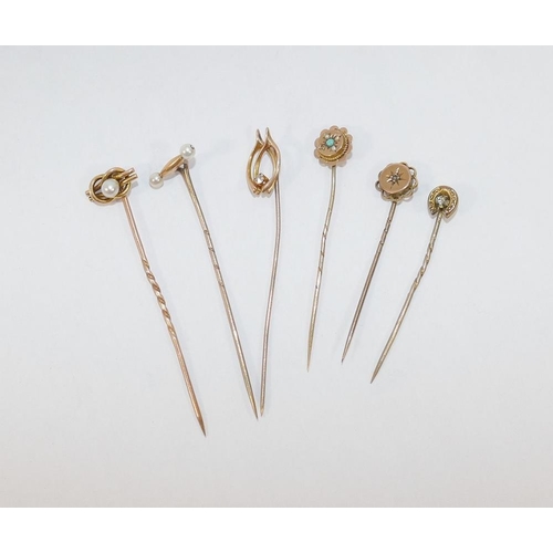 16A - A collection of six Victorian and early 20th century gold stick pins, including pearl and diamond se... 