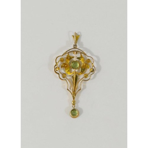 17 - An Edwardian peridot and split pearl openwork pendant, stamped '15C', 5.3cm long, 4.3g gross