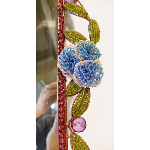 183 - A vintage rectangular mirror with floral and foliate beaded surround, mounted to steel wire and fram... 