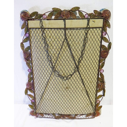 183 - A vintage rectangular mirror with floral and foliate beaded surround, mounted to steel wire and fram... 