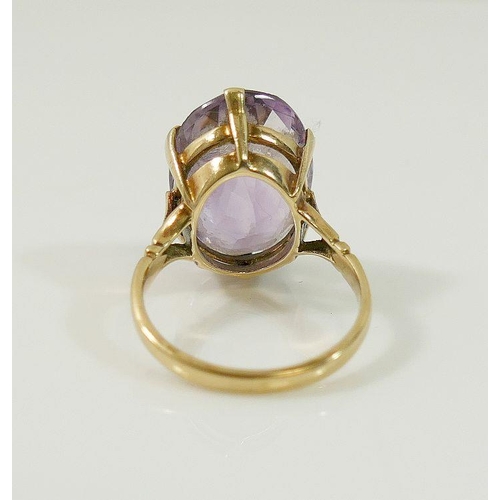 19A - A 9ct gold amethyst single stone ring, London 1962, finger size M1/2, and a smokey quartz single sto... 