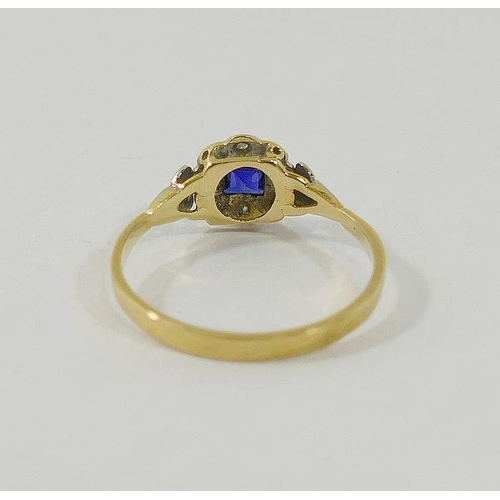 19 - An early 20th century sapphire and diamond ring, the white head of the ring set with square mixed cu... 