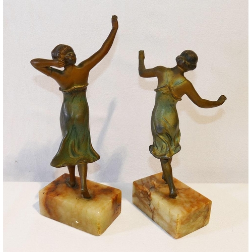 196 - A pair of Art Deco bronzed spelter dancing ladies, each mounted to a marble rectangular base, 27cm a... 