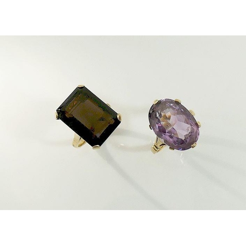 19A - A 9ct gold amethyst single stone ring, London 1962, finger size M1/2, and a smokey quartz single sto... 