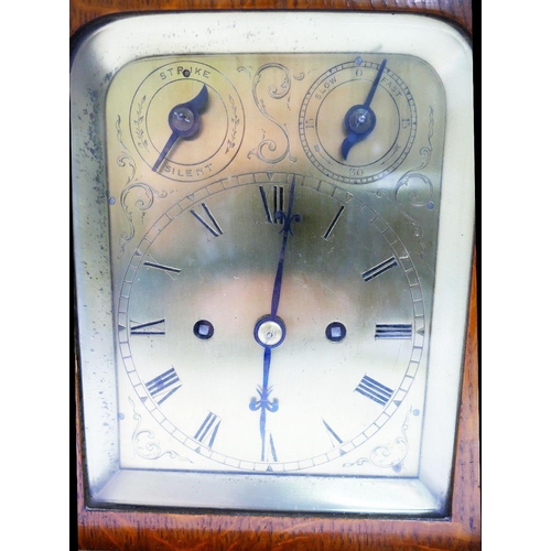 204 - A late Victorian oak cased chiming table clock, with pierced sound fret sides, the brass dial with t... 