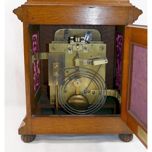 204 - A late Victorian oak cased chiming table clock, with pierced sound fret sides, the brass dial with t... 