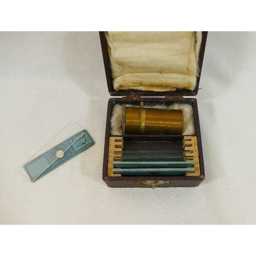 205 - A 'Midgard' pocket microscope, 4.8cm long, in original fitted case, with six glass slides