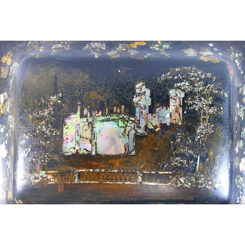 213 - A Victorian papier maché table top cabinet, inlaid with mother of pearl and decorated in gilt, the h... 