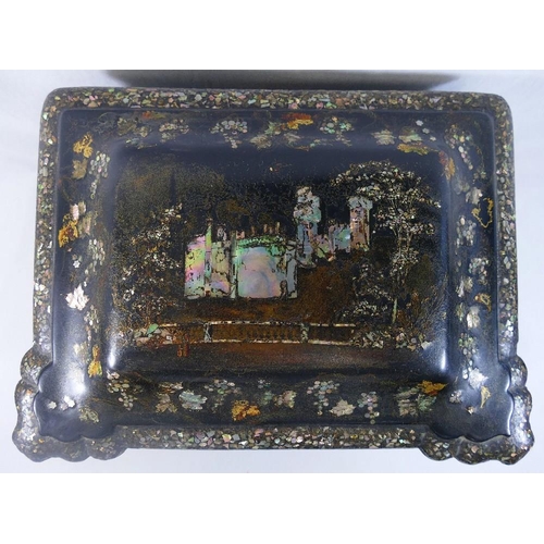 213 - A Victorian papier maché table top cabinet, inlaid with mother of pearl and decorated in gilt, the h... 