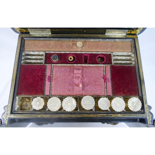 213 - A Victorian papier maché table top cabinet, inlaid with mother of pearl and decorated in gilt, the h... 