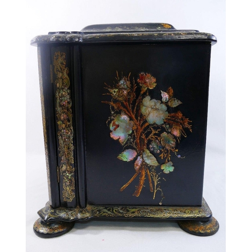 213 - A Victorian papier maché table top cabinet, inlaid with mother of pearl and decorated in gilt, the h... 