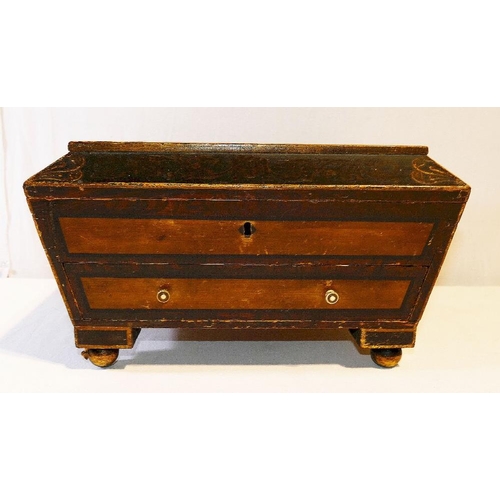 215 - A 19th century painted pine sarcophagus-shaped work box, with hinged lid and single drawer fitted wi... 