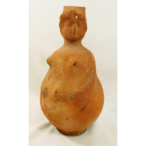 221 - Three terracotta items comprised of a figural jug in the form of a pregnant woman, 22cm high, a shar... 