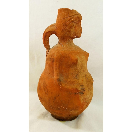 221 - Three terracotta items comprised of a figural jug in the form of a pregnant woman, 22cm high, a shar... 