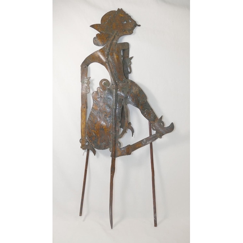 227A - An Indonesian shadow puppet, of painted leather construction with wooden frame and jointed limbs, 71... 