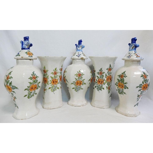 229 - A garniture of five 19th century Dutch Delft polychrome vases, three of baluster form, the lids with... 