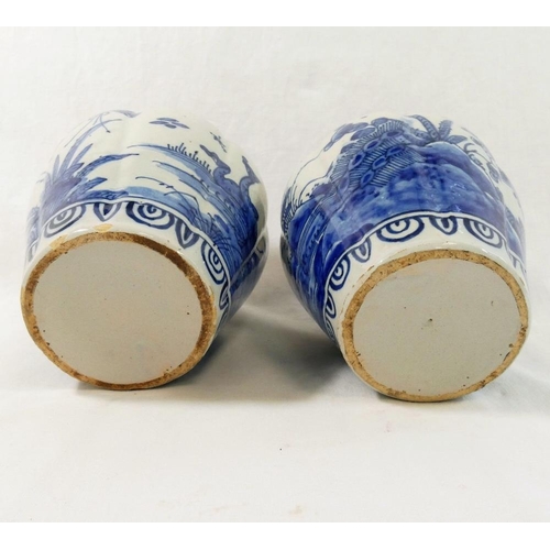 256 - A pair of 18th century Dutch delft lobed baluster vases, decorated with ducks and birds amongst blos... 