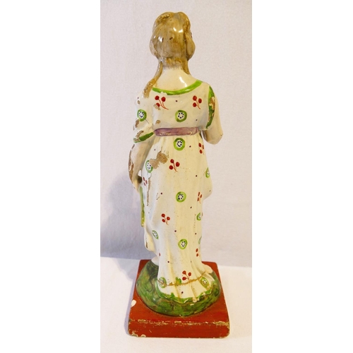 260 - An early 19th century Stafforshire Pearlware figure of Aphrodite holding a dove, 27cm high