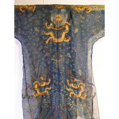 281 - A Chinese late Qing dynasty summer gauze dragon robe (Jifu), the fine blue mesh-like fabric embroide... 