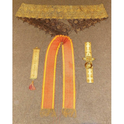 283 - A long gilt embroidered trim, 29cm wide x 265cm long, a gilt metal mounted bell pull, a smaller bell... 