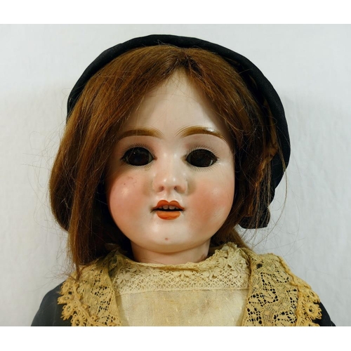 288 - A Schoenau & Hoffmeister early 20th century bisque socket head doll, with brown glass sleeping eyes,... 