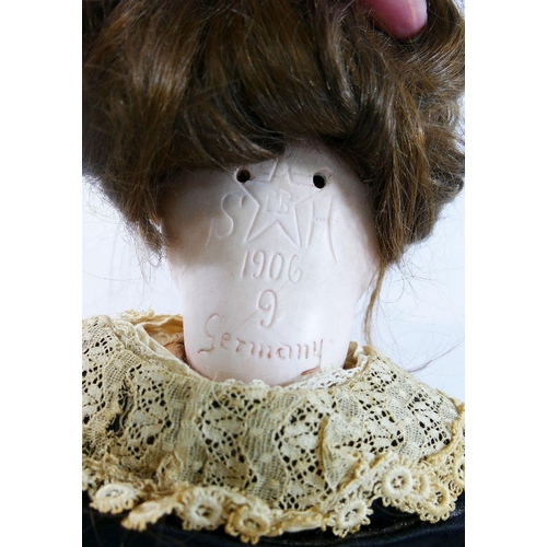 288 - A Schoenau & Hoffmeister early 20th century bisque socket head doll, with brown glass sleeping eyes,... 