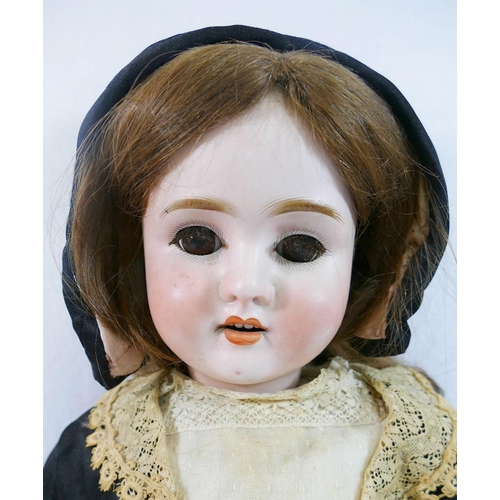 288 - A Schoenau & Hoffmeister early 20th century bisque socket head doll, with brown glass sleeping eyes,... 