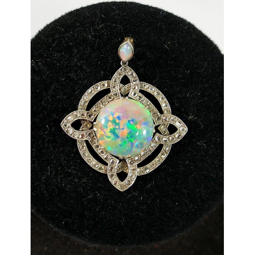 29 - An early 20th century opal and diamond pendant, the central circular opal cabochon 12.5mm diameter x... 