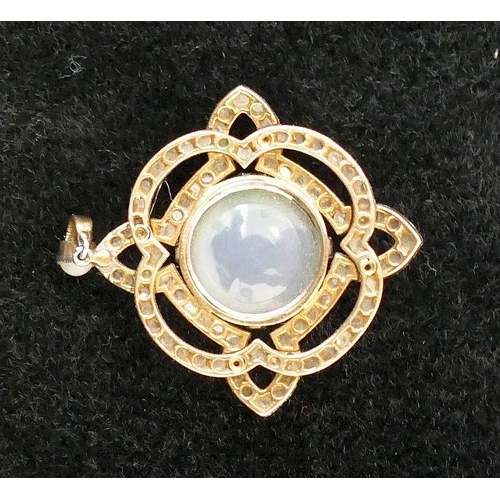 29 - An early 20th century opal and diamond pendant, the central circular opal cabochon 12.5mm diameter x... 