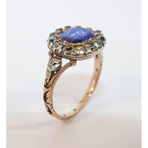 3A - A Georgian sapphire and diamond oval cluster ring, housed ornately in engraved closed back setting, ... 