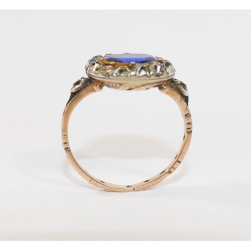 3A - A Georgian sapphire and diamond oval cluster ring, housed ornately in engraved closed back setting, ... 