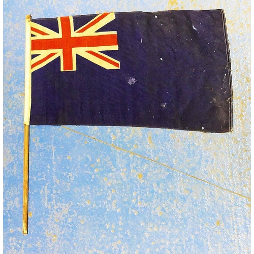 312A - A vintage British blue ensign flag 44cm x 83cm attached to a wooden pole and a vintage Union Jack fl... 