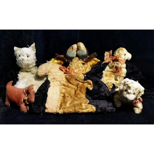 314A - Four novelty vintage plush tea cosies, in the form of a black and white cat  a squirrel, a parrot an... 