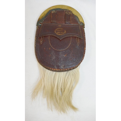 315A - A Scottish leather and white horse hair sporran by Marshall and Aitken of Edinburgh, with brass moun... 