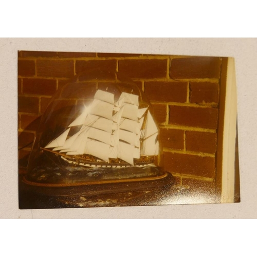 319 - A glass cased 19th century model of four sailing vessels in stormy seas, with handwritten note - '4 ... 