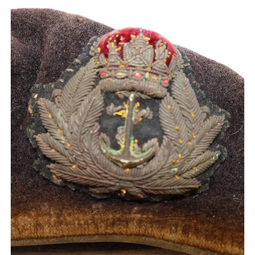 330 - A WWII British Royal Navy velvet beret with embroidered badge